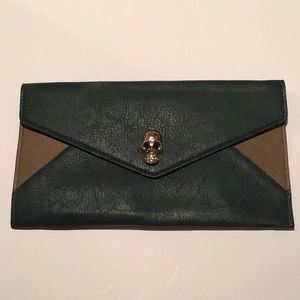 Forest green clutch with skull snap